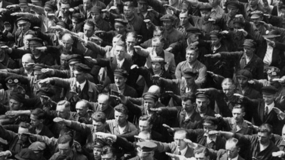 "1936 photo, in which a man alleged to be August Landmesser is conspicuously not giving the Nazi salute"